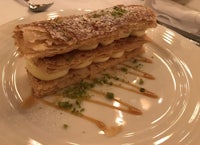 a white plate with a pastry on it